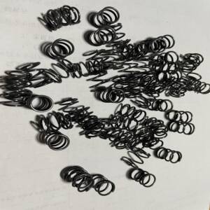 Custom nitinol wire spring with etched surface for industrial actuator